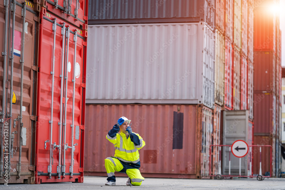Poster Engineer or foreman checking about shipping of container box in warehouse stock yard.