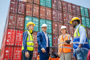 Worker and businessman checking containers data for export and import,Container loading Cargo freight ship.