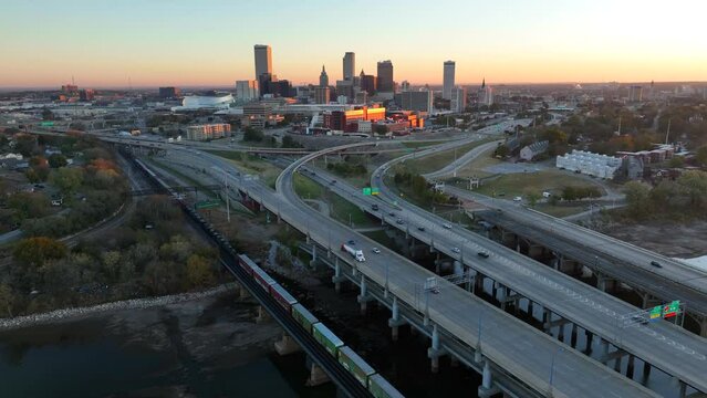 Tulsa Oklahoma skyline at sunrise. Aerial of interstate highway bridges.