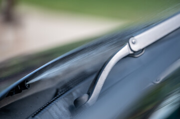 Under hood windshield washer jet used to spray liquid to clean glass on a vehicle. 
