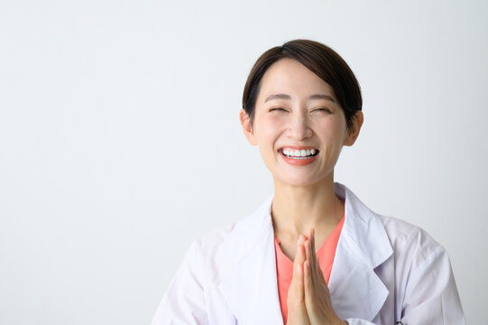 Pleasant image of an easy-to-use doctor (female doctor) in a white coat, smiling and laughing