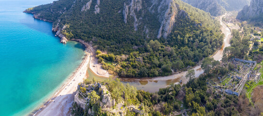 Panoramic drone view of Olympos Ancient City and Olympos beach on sunny winter day. Turkey.