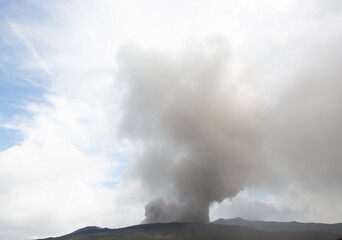 Fototapeta na wymiar Grey smoke from the Aso volcano, Kumanoto, Kyushu, Japan