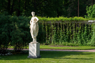 View of the statue of a dancer in the private garden of the Catherine Park in Tsarskoye Selo on a...