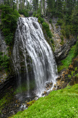 Narada Falls, a braded waterfall, viewed from below in Mt. Rainier National Park
