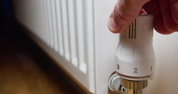 Thermostatic Radiator Valves | close up of a hand of a man with switch the heat level 5 maximum on the scale | 4k 12-bit footage | basic color correction