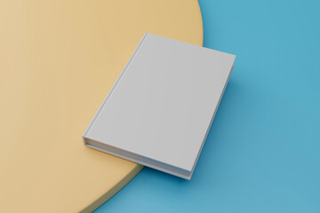 Hardcover blank book template, one empty book lying on blue and orange background