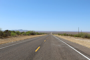 Fototapeta na wymiar US Route 385 with no cars south of Fort Stockton, Texas
