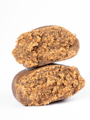isolated cannabis hash piece, brown hashish on white background