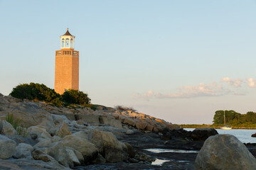 Fototapeta na wymiar Avery Point Lighthouse in Groton Connecticut Atlantic Ocean at Low Tide