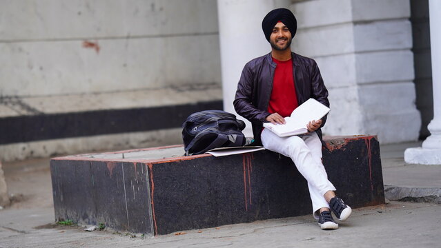 handsome sikh boy in college campus sikh college student image