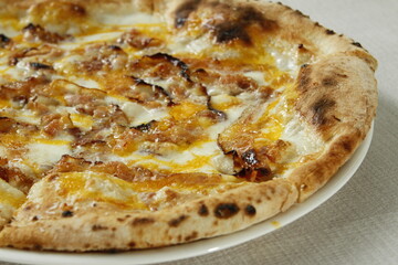 Carbonara pizza with bacon, cheese and egg yolks