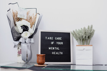 Take care of your mental health, words motivational quote on the letter board.
