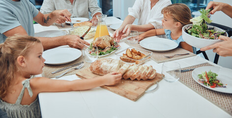 Big family, food and lunch at table in home, eating and bonding. Fine dining, bread and father,...