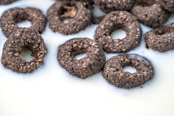 Chocolate flakes in milk in the form of rings close-up
