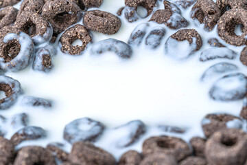 Chocolate flakes in milk in the form of rings close-up