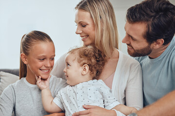 Family, baby and girl with father and mother in living room, having fun and bonding. Love, support and happy man, woman and kid with infant smiling, caring and enjoying quality time together in home.