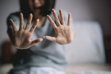 The woman held up her five-fingered hands, intent on telling her not to interfere. Concept of...