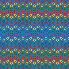 Circles with multicolored holes on a blue background. Christmas seamless pattern.