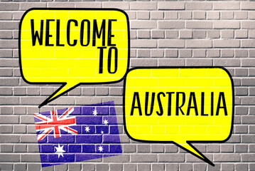 Fototapeta premium Australische Flagge und Graffiti Text an einer Wand Willkommen in Australien