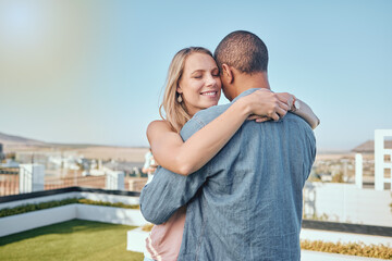 Rooftop, love and couple hug in city enjoying summer holiday, weekend and vacation in Los Angeles. Romance, relationship and interracial man and woman embrace, bonding and hugging on urban adventure