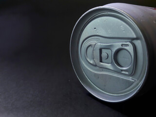 photo of a can of a drink with a black background