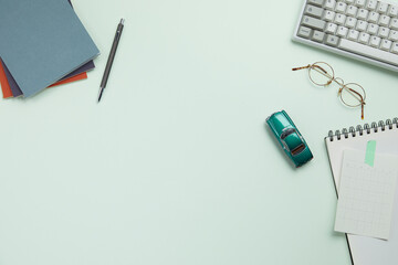 office supplies on the modern green desk. top view and copy space