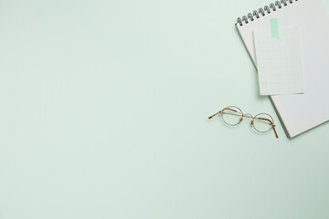 office supplies on the modern green desk. top view and copy space