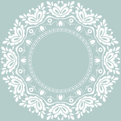Oriental pattern with arabesques and floral elements. Traditional classic light blue and white round ornament. Vintage pattern with arabesques