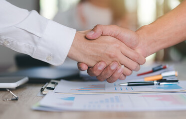 business people shaking hands indicating agreement business,concept progress in development, financial efficiency and investment with business strategy for goals and opportunities in industry future