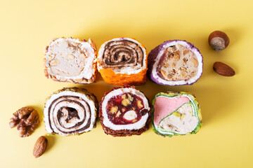 Assorted traditional national sweets of Turkey on a yellow background. Southwest Asian Dish.