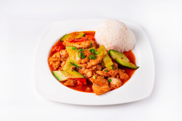 chicken meat with vegetables and rice on a white background
