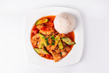 chicken meat with vegetables and rice on a white background