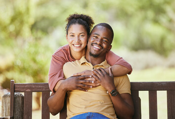 Love, portrait and couple hug in a garden, happy and smile while sitting, relax and bond in nature. Face, black family and man with woman in a park, quality time and enjoying peaceful day in Mexico