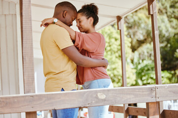 Hug, love and black couple with care, peace and praying on the porch of their house together in New...