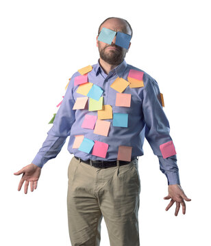 Confused businessman covered with sticky notes
