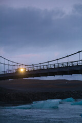Bridge over frozen sea gulf landscape photo. Beautiful nature scenery photography sunset sky with on background. Idyllic scene. High quality picture for wallpaper, travel blog, magazine, article