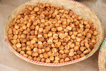 Street market, Madagascar food, small fried dough balls with bacon in a bowl of grass, authentic life in Madagascar.