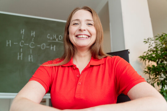 Happy Chemistry Teacher Wearing Red Polo Shirt