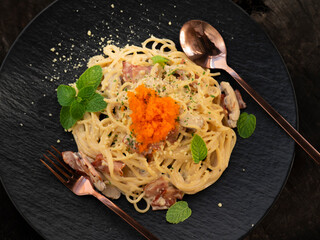 Carbonara pasta. Spaghetti with cream sauce. Traditional italian cuisine. Top view.