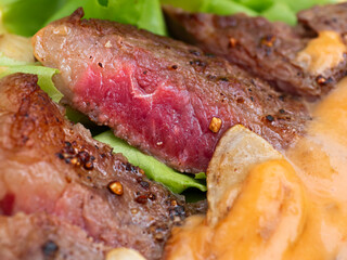 Beef rib eye steak with rice and vegetable. Healthy balanced food concept. topped spicy sauce. Close up