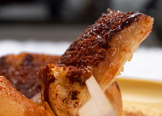 Toast topped with sweetened condensed milk and chocolate.