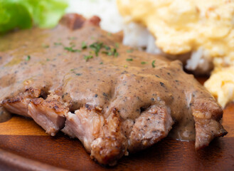 Grilled pork neck topped rice and tabasco, Thai food and Asian food.