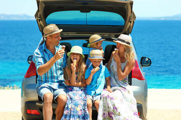 family near the sea by car