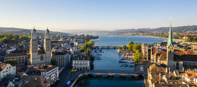 Aerial drone shot flying above Lake Zurich, Switzerland in sunny day.