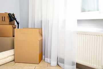 Fototapeta premium Concept of move in modern flat with boxes