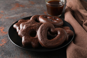 Concept of tasty bakery, gingerbread cookies in chocolate, close up