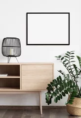 Fotobehang Boho Blank frame mockup in modern interior design with trendy plant on empty white wall background, Horizontal template for painting, photo or poster. Artwork mock-up  © kite_rin