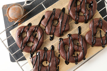 Concept of tasty bakery, gingerbread cookies in chocolate, top view