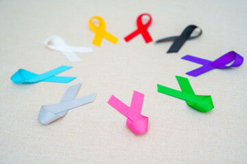 World cancer day, February 4. Colorful ribbons for supporting people living and illness. Healthcare, fighting, medical and National Cancer Survival day, Autism awareness day concept